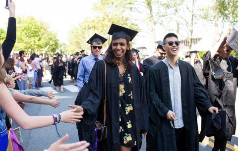Graduates are greeted during the procession.