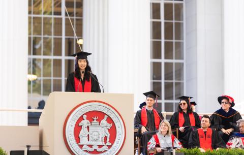Image of Anna Sun at the podium delivering the salute from the Undergraduate Students
