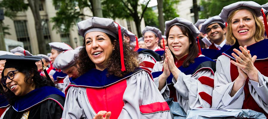 Doctoral candidates clap in the audience; Photo: Jake Belcher