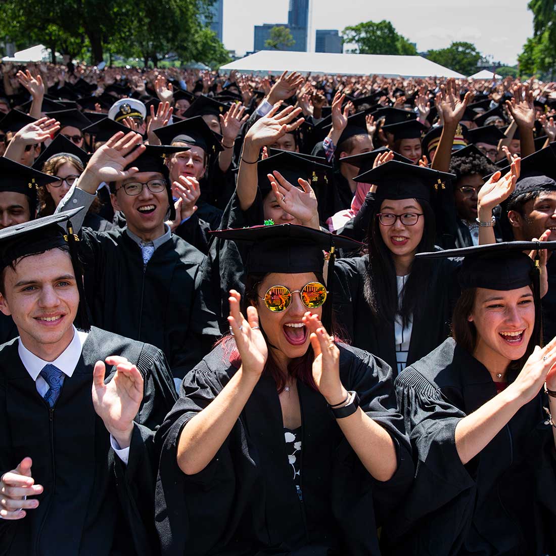 MIT graduates cheer and clap in audience; photo: Dominick Reuter