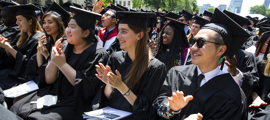 Graduates clapping in Killian Court during Commencement 2018