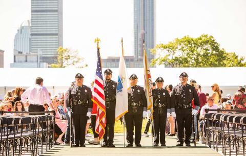 The MIT Police Honor Guard presents the flags 