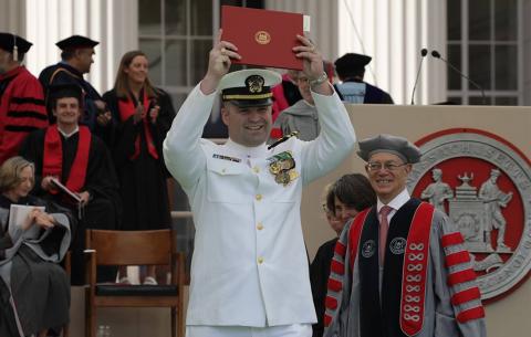 ROTC graduate exits stage with his diploma