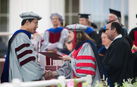 Chancellor Barnhart greets one of MIT's newest PhDs; photo: Jake Belcher