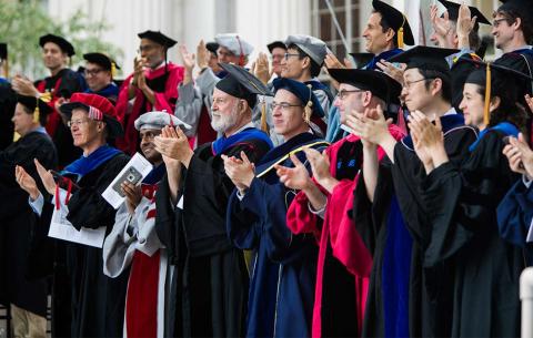 Faculty applaud MIT's newest PhDs; photo: Jake Belcher