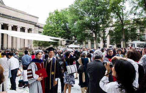 After the ceremony, MIT's newest PhDs take photos with family and friends; photo: Jake Belcher