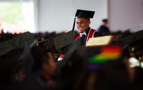 Image of a smiling graduate at the Undergraduate Ceremony