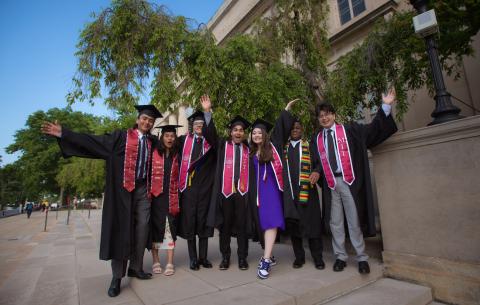 Image of a group of undergraduate students posing in their regalia