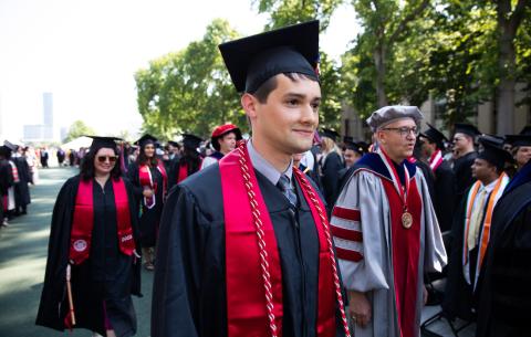 Image of AJ Miller, President of the Graduate Student Council during the academic procession