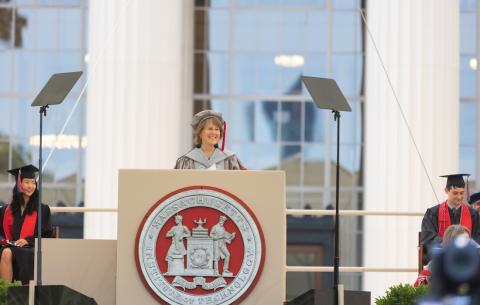 Image of Diane Greene, Chair of the MIT Corporation, at the podium, delivering the opening remarks