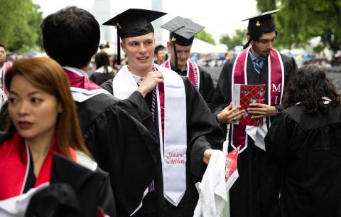 Image of graduate before being seated for the OneMIT Commencement Ceremony