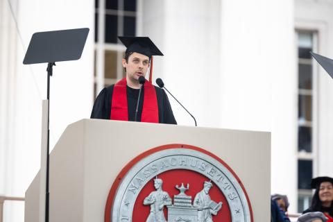 Image of Teddy Warner at the podium during the OneMIT Commencement Ceremony